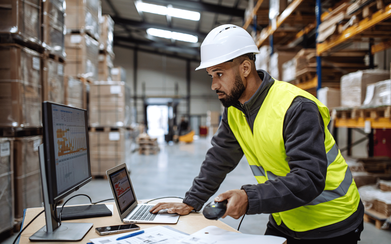 Warehouse worker using a handheld scanner